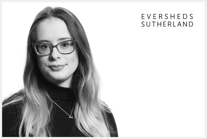 Black and white photo of Heather Lacey with Eversheds Sutherland logo