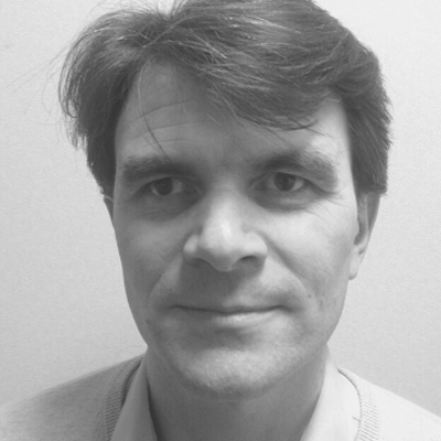 Black and white photo of Robin Christopherson with AbilityNet logo